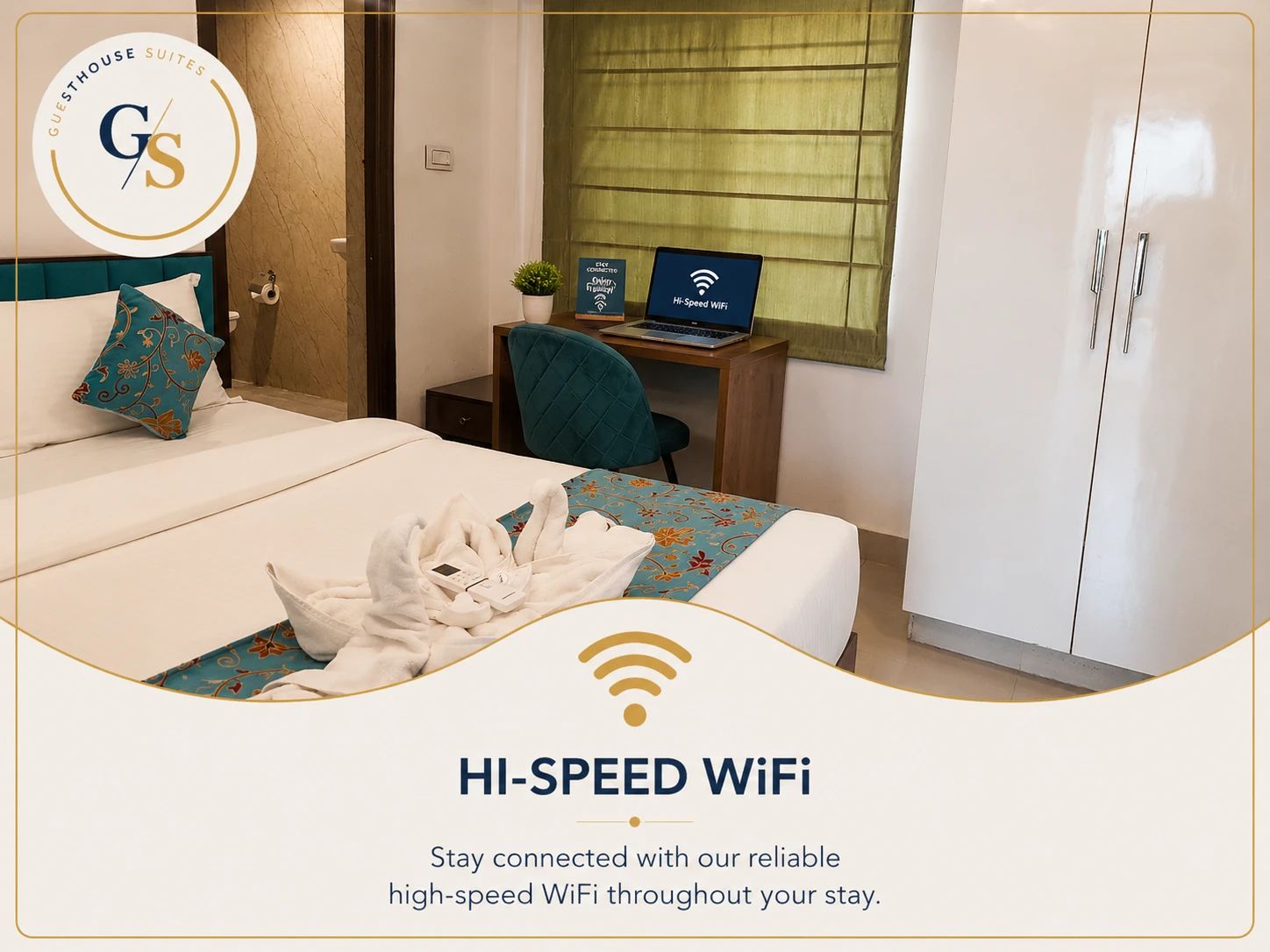In-room workspace with high-speed Wi‑Fi and study table at Guest House Suites Bangalore